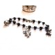 Bracelet rosaire perles noires revisité Alice aux pays des merveilles 